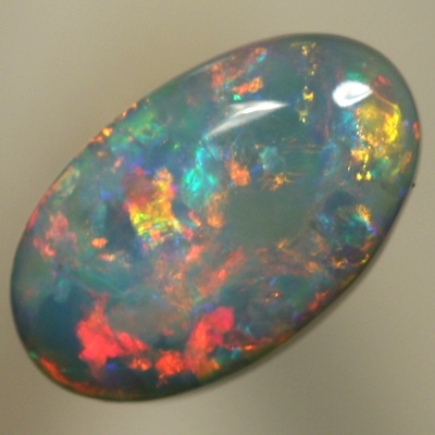 SOLID SEMI BLACK OPAL Rolling flashes of red and yellow over turquoise blue